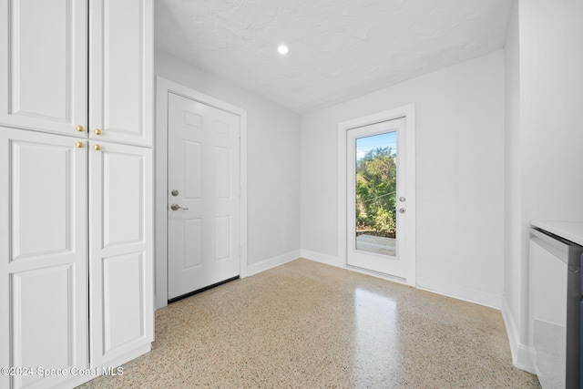 interior space with a textured ceiling