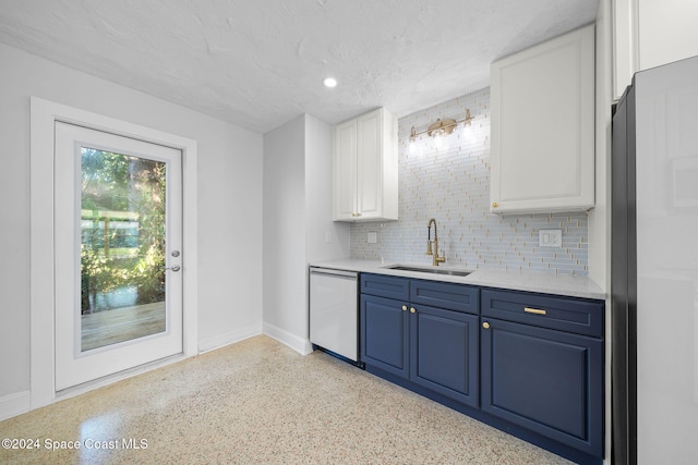 kitchen with blue cabinetry, sink, a textured ceiling, dishwashing machine, and white cabinets