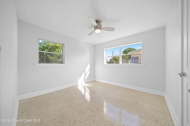 unfurnished room featuring ceiling fan