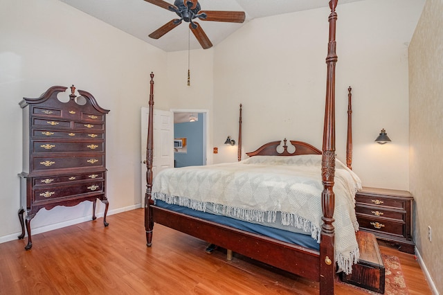 bedroom featuring vaulted ceiling, wood-type flooring, and ceiling fan