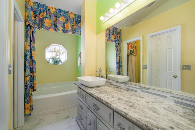 bathroom with tile floors, a bathtub, and oversized vanity