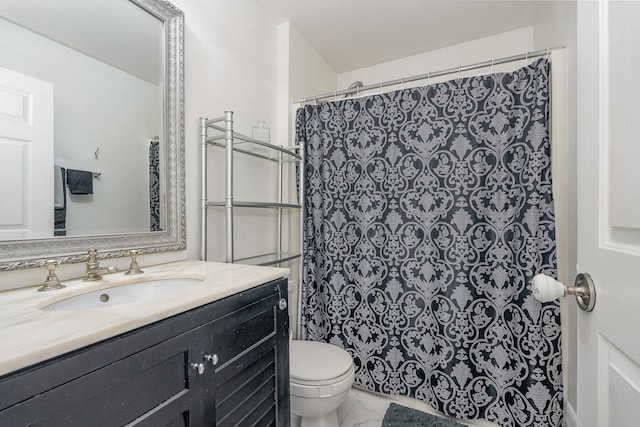 bathroom with tile flooring, large vanity, and toilet