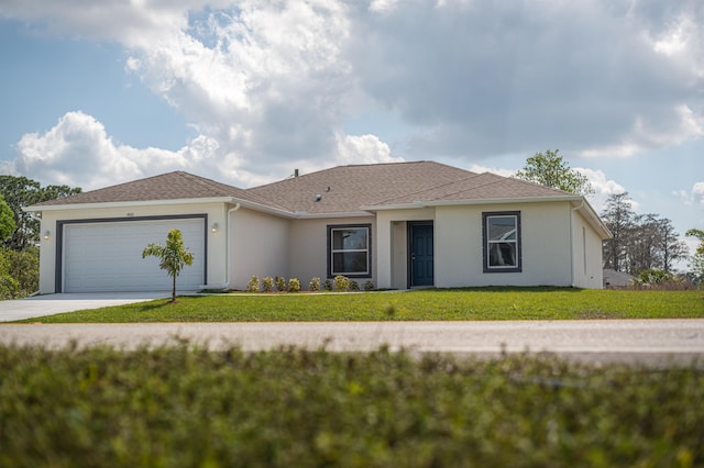 ranch-style home with a front lawn and a garage