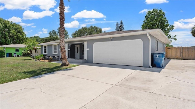 single story home featuring a front yard and a garage