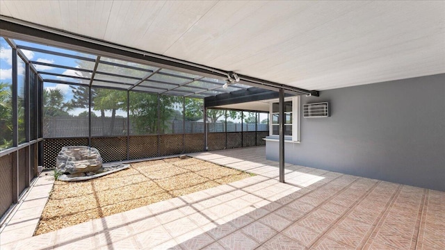 view of patio with a wall unit AC and a lanai