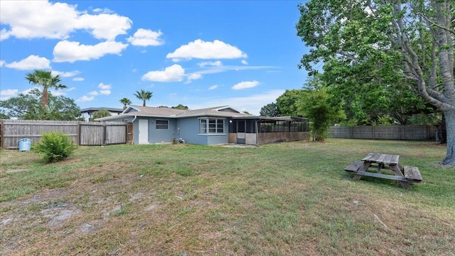 view of yard featuring a sunroom