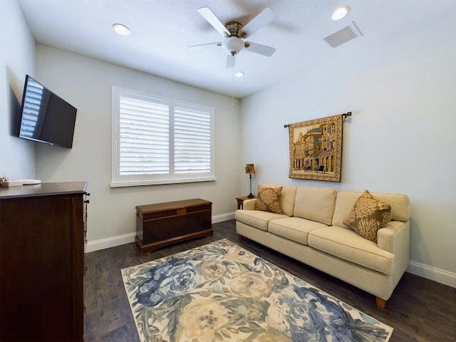 living room with dark hardwood / wood-style floors and ceiling fan