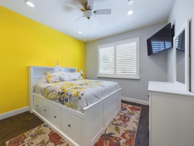 bedroom featuring dark hardwood / wood-style flooring and ceiling fan