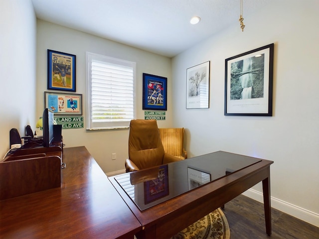 home office with dark hardwood / wood-style flooring