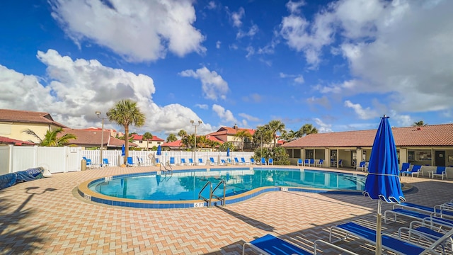3173 Beach Winds Ct, Melbourne Beach, FL 32951 - community pool featuring a patio area
