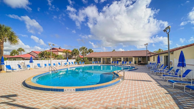 3173 Beach Winds Ct, Melbourne Beach, FL 32951 - community pool featuring a patio
