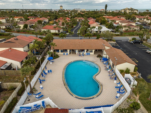 3173 Beach Winds Ct, Melbourne Beach, FL 32951 - community pool featuring a residential view