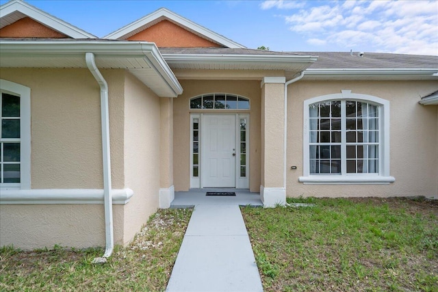 entrance to property with a yard