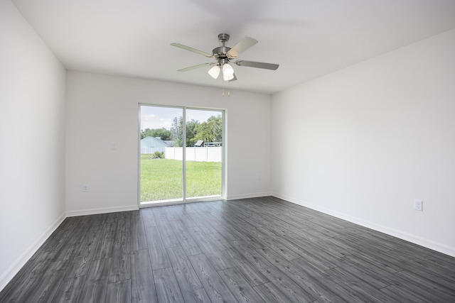 unfurnished room with ceiling fan and dark hardwood / wood-style flooring