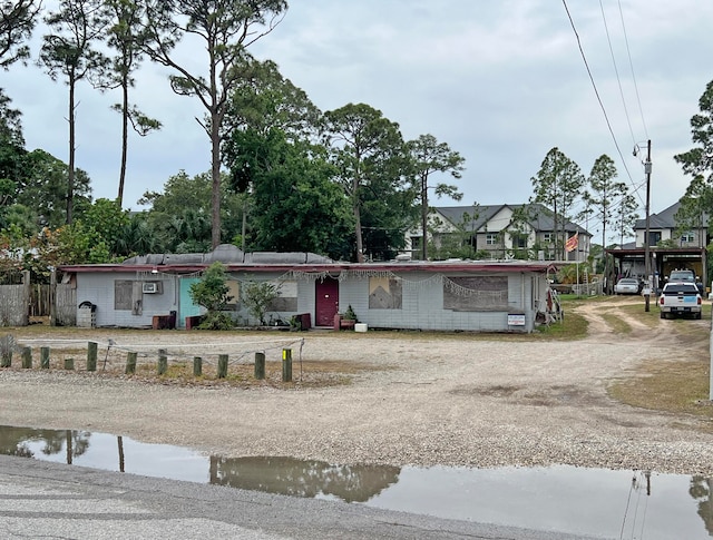 view of front of property with a carport