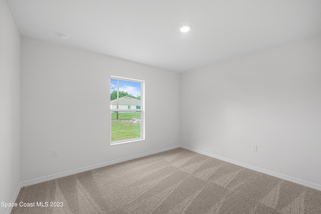 unfurnished room with carpet floors