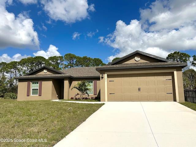 ranch-style home featuring a garage and a front lawn