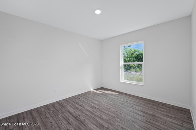 unfurnished room featuring hardwood / wood-style flooring