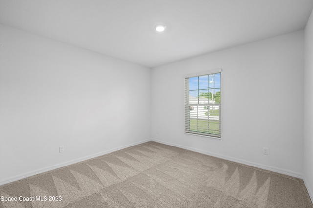 unfurnished room featuring carpet floors