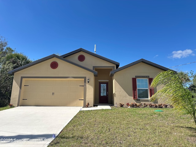 single story home with a garage and a front lawn