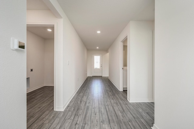 corridor with wood-type flooring