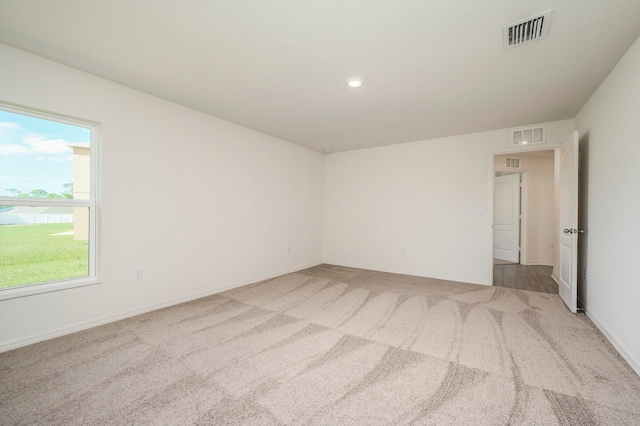 unfurnished room featuring carpet flooring