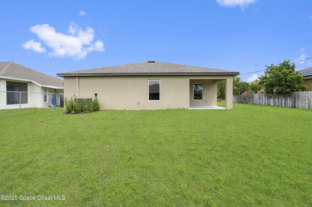 318 Hammonton St SW, Palm Bay, FL 32908 - rear view of property with stucco siding and a patio area