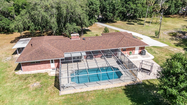 view of swimming pool with a patio and a yard