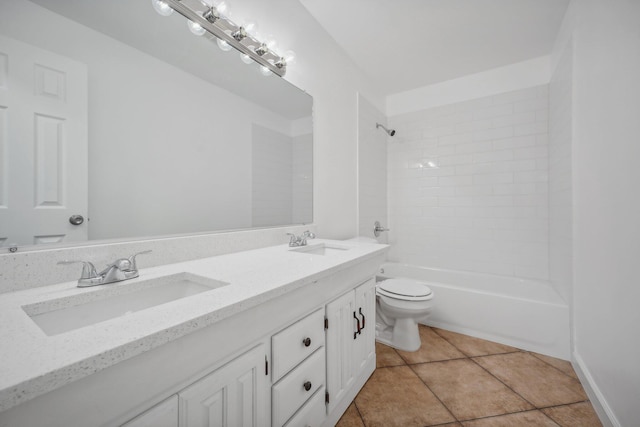 full bathroom featuring dual vanity, tiled shower / bath combo, toilet, and tile patterned floors