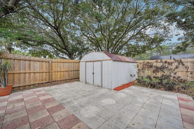 view of patio / terrace with a storage shed