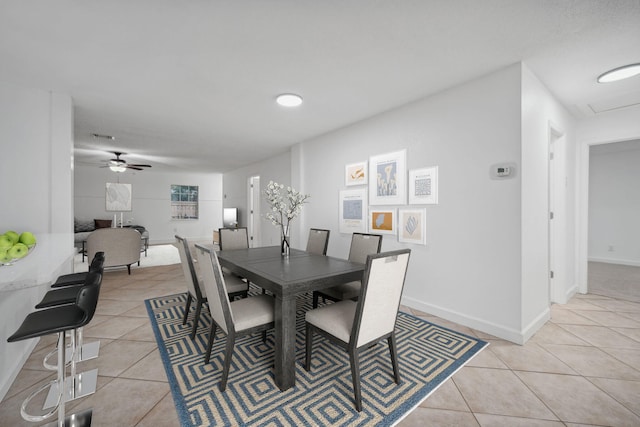 dining room with ceiling fan and light tile patterned floors