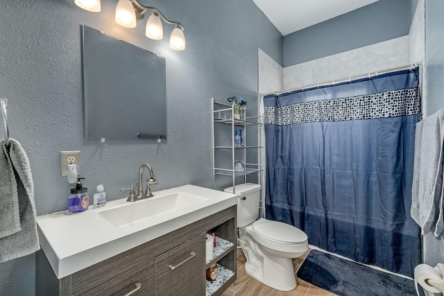 full bathroom featuring shower / tub combo, vanity, hardwood / wood-style flooring, and toilet