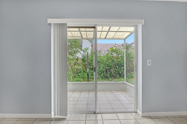 doorway to outside featuring light tile floors