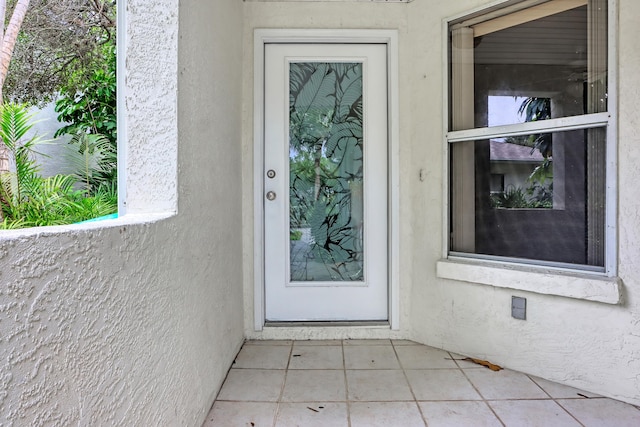 property entrance featuring a patio area