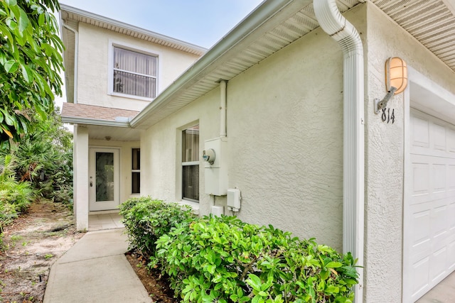 view of exterior entry featuring a garage