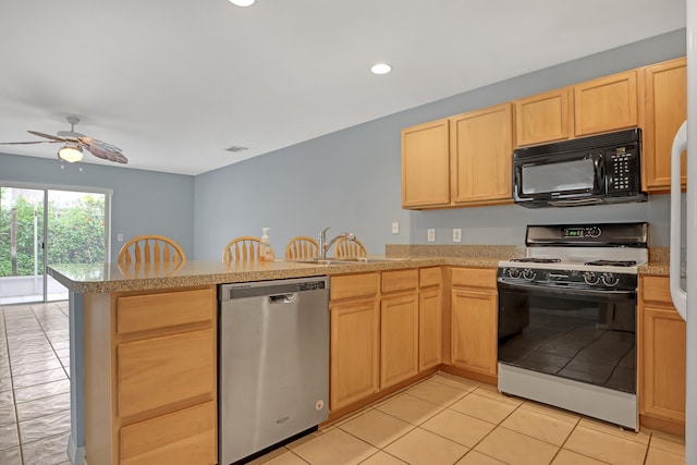 kitchen with kitchen peninsula, white range with gas cooktop, ceiling fan, stainless steel dishwasher, and light tile floors