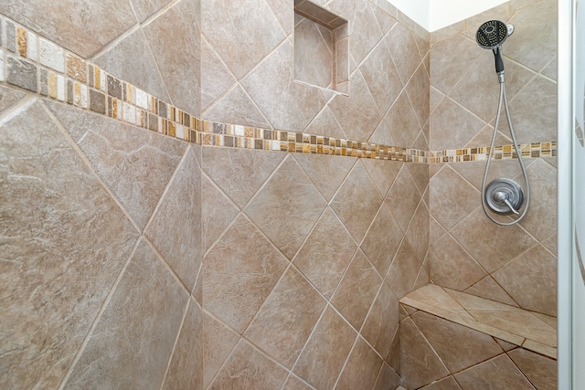 interior space with tiled shower