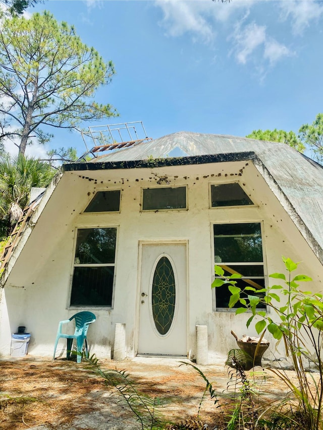 view of exterior entry featuring a mountain view