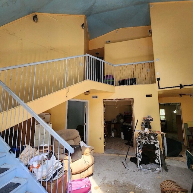 living room featuring a high ceiling