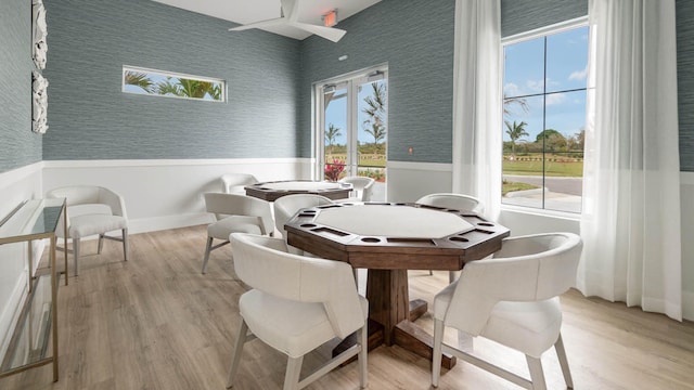 dining space with light hardwood / wood-style floors and plenty of natural light