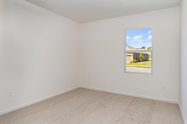 spare room with carpet flooring