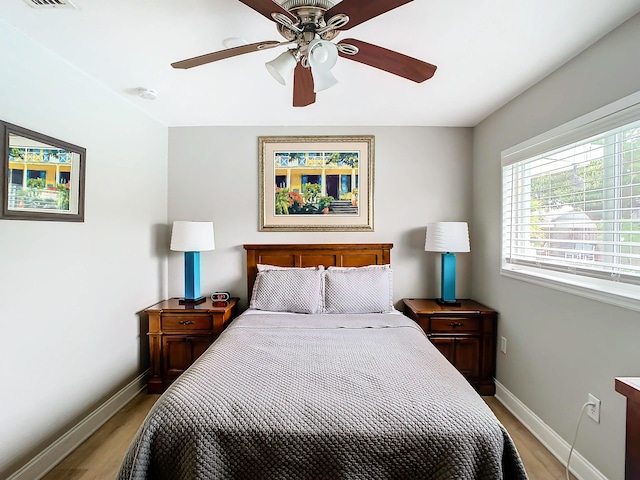 280 Monroe Ave, Cape Canaveral, FL 32920 - bedroom featuring light wood-style flooring, baseboards, and a ceiling fan