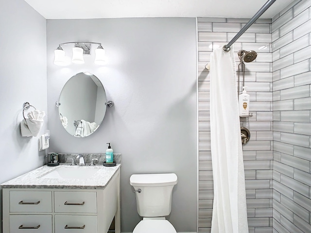 280 Monroe Ave, Cape Canaveral, FL 32920 - full bathroom featuring vanity, toilet, and tiled shower