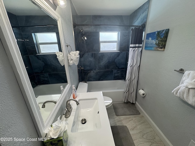 280 Monroe Ave, Cape Canaveral, FL 32920 - full bathroom with shower / bathtub combination with curtain, marble finish flooring, baseboards, toilet, and vanity