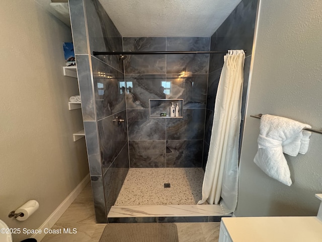 280 Monroe Ave, Cape Canaveral, FL 32920 - bathroom featuring a tile shower, baseboards, and a textured ceiling