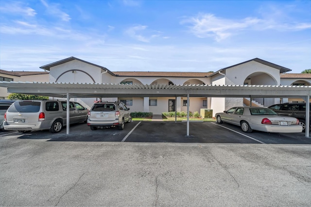 exterior space with a carport