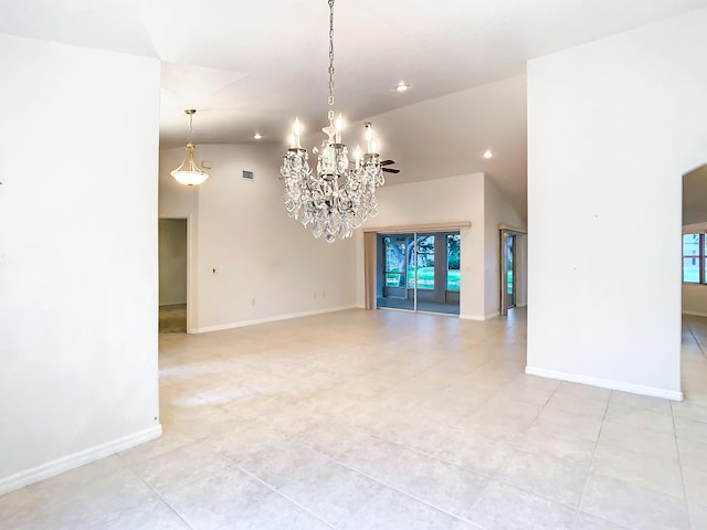 interior space with high vaulted ceiling, a wealth of natural light, and a chandelier