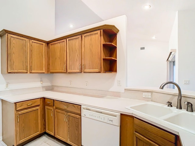 kitchen featuring light tile patterned flooring, dishwasher, and sink