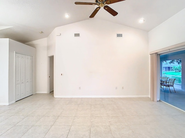 unfurnished living room with light tile patterned flooring, high vaulted ceiling, and ceiling fan