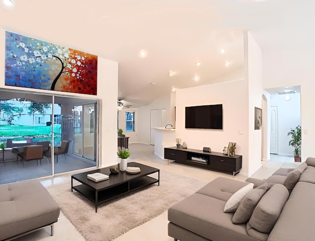 living room featuring vaulted ceiling and ceiling fan